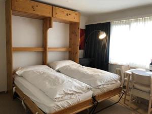 Giường trong phòng chung tại Paradies 04