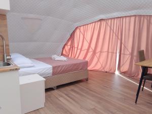 Voodi või voodid majutusasutuse Glamping Machakhela 2 toas
