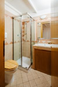 a bathroom with a shower and a toilet and a sink at Aurora in Rome +20 photos