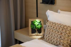 Postel nebo postele na pokoji v ubytování Hotel Kardinal