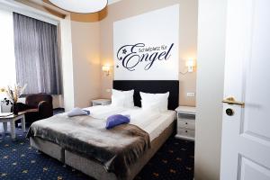 Postel nebo postele na pokoji v ubytování Hotel Villa Schwanebeck