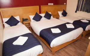 Llit o llits en una habitació de St Mark Hotel