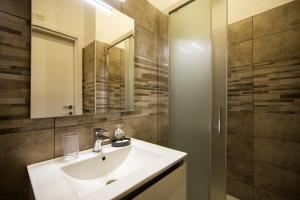 a bathroom with a sink and a mirror at Inn Rhome S Pietro Suites in Rome +38 photos