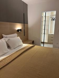 Postel nebo postele na pokoji v ubytování Hotel Kardinal