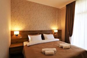 Postel nebo postele na pokoji v ubytování Hotel Giorgi Tbilisi