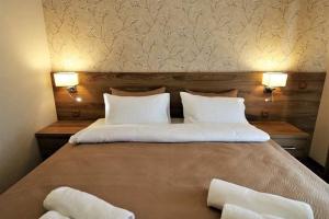 Postel nebo postele na pokoji v ubytování Hotel Giorgi Tbilisi