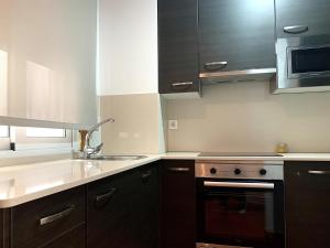 Η κουζίνα ή μικρή κουζίνα στο Vigo Center Rooms +19 φωτογραφίες