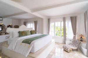 Tempat tidur dalam kamar di La Santa Rosa