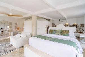 Tempat tidur dalam kamar di La Santa Rosa