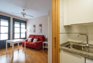 A kitchen or kitchenette at Torneo Suite Apartment