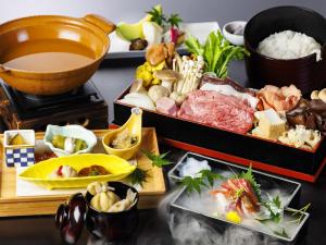a table topped with different types of food at Hakone Kowakien Mikawaya Ryokan in Hakone