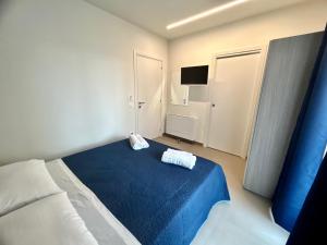 Postel nebo postele na pokoji v ubytování Arkè Rooms