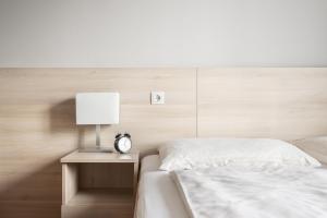 Posteľ alebo postele v izbe v ubytovaní myNext - Hotel Rudy
