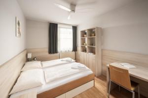 Posteľ alebo postele v izbe v ubytovaní myNext - Hotel Rudy