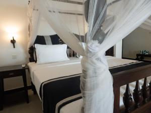 Ein Bett oder Betten in einem Zimmer der Unterkunft Suite Lanka