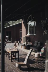 a patio with two chairs and a table and a couch at Dew&Plum 白露梅室 in Ruisui