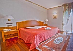 Postel nebo postele na pokoji v ubytování Hotel Lory & Ristorante Ferraro