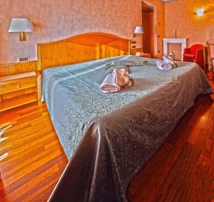 Postel nebo postele na pokoji v ubytování Hotel Lory & Ristorante Ferraro