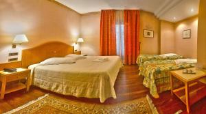 Postel nebo postele na pokoji v ubytování Hotel Lory & Ristorante Ferraro