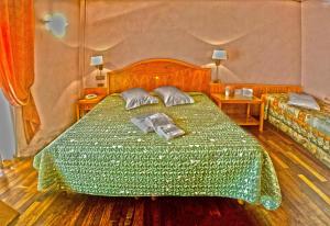 Postel nebo postele na pokoji v ubytování Hotel Lory & Ristorante Ferraro + 37 fotografií