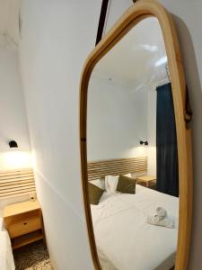 a bedroom with a mirror and a bed at Cosy room 2 in Pieta