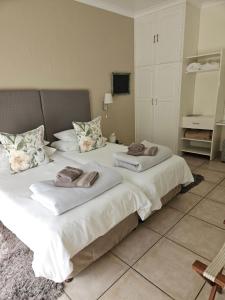 Postel nebo postele na pokoji v ubytování Stannards Guest Lodge 4 Star B&B, Knysna