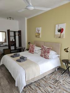 Postel nebo postele na pokoji v ubytování Stannards Guest Lodge 4 Star B&B, Knysna + 37 fotografií
