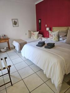 Postel nebo postele na pokoji v ubytování Stannards Guest Lodge 4 Star B&B, Knysna