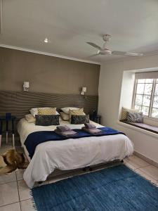Postel nebo postele na pokoji v ubytování Stannards Guest Lodge 4 Star B&B, Knysna