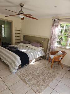 Postel nebo postele na pokoji v ubytování Stannards Guest Lodge 4 Star B&B, Knysna