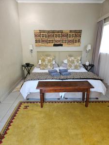 Postel nebo postele na pokoji v ubytování Stannards Guest Lodge 4 Star B&B, Knysna