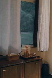 a table in a room with a window at Dew&Plum 白露梅室 in Ruisui