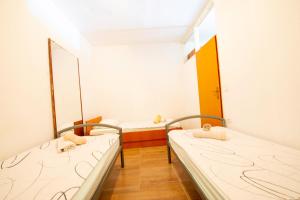 Postel nebo postele na pokoji v ubytování Apartments Claudia