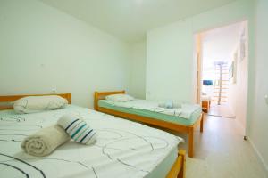Postel nebo postele na pokoji v ubytování Apartments Claudia
