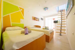 Postel nebo postele na pokoji v ubytování Apartments Claudia