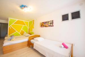 Postel nebo postele na pokoji v ubytování Apartments Claudia