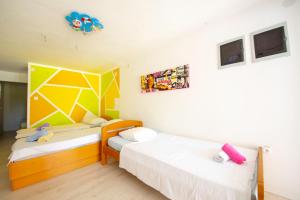 Postel nebo postele na pokoji v ubytování Apartments Claudia