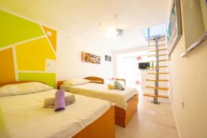 Postel nebo postele na pokoji v ubytování Apartments Claudia
