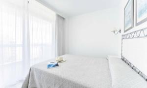 Palm Beach - Excel Hotels & Resorts客房内的一张或多张床位