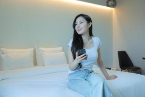Łóżko lub łóżka w pokoju w obiekcie VIP Hotel Mokpo