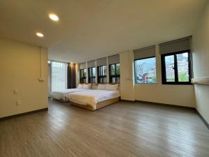 Postel nebo postele na pokoji v ubytování 慢且洄瀾文旅 Bantshiann Hualie Hotel