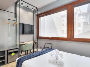 Postel nebo postele na pokoji v ubytování B&B Hotel Milano City Center Duomo