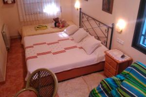 a bedroom with a bed with a teddy bear on it at Beach villa with pool and near BCN & TGN in Cunit +22 photos