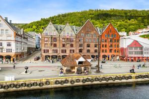 a view of a city with buildings and a bridge at Home Hotel Bryggen in Bergen