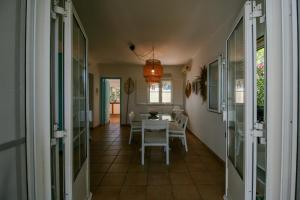 a dining room with a table and chairs at FLH Praia Verde Rooftop House in Praia Verde +17 photos