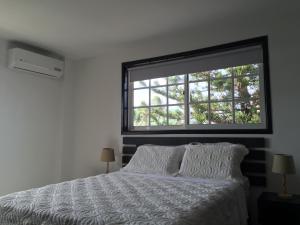 מיטה או מיטות בחדר ב-Hostal Marlyn