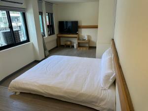 Postel nebo postele na pokoji v ubytování 慢且洄瀾文旅 Bantshiann Hualie Hotel