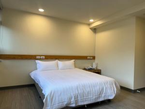 Postel nebo postele na pokoji v ubytování 慢且洄瀾文旅 Bantshiann Hualie Hotel