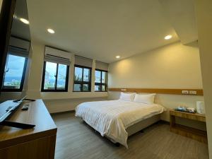Postel nebo postele na pokoji v ubytování 慢且洄瀾文旅 Bantshiann Hualie Hotel