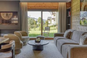 Posezení v ubytování Charmant Appartement au Cœur de Megève avec Jardin privatif